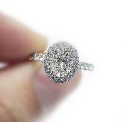Oval Shaped Halo Style Diamond Engagement Ring